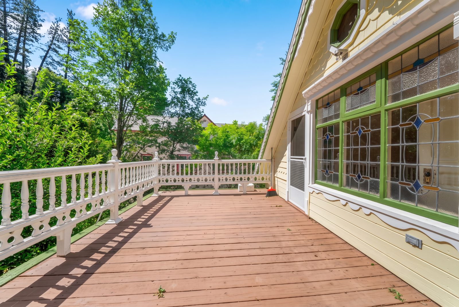 Upper deck with turned balusters and leaded glass windows