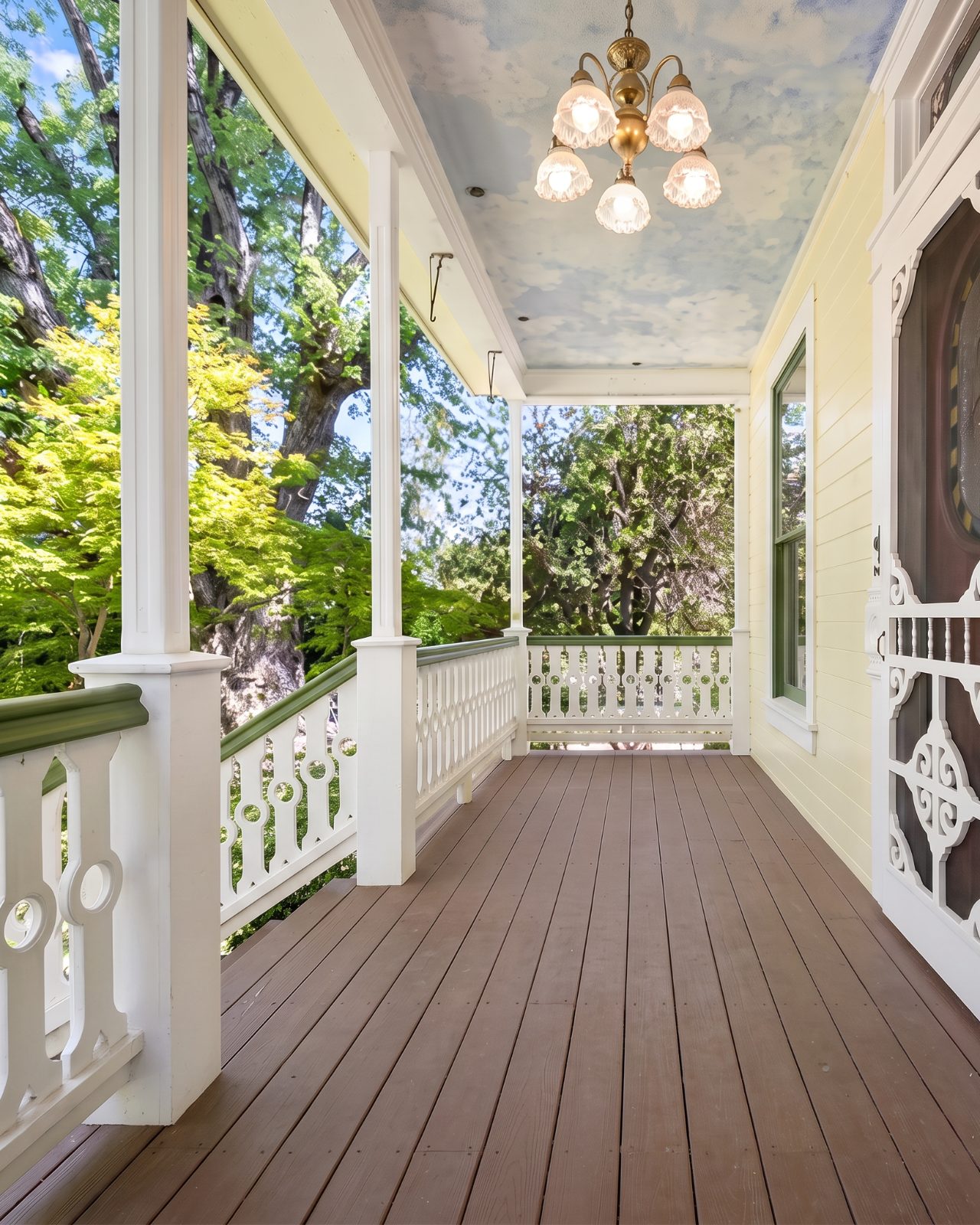 Front porch with painted sky ceiling and original screen door